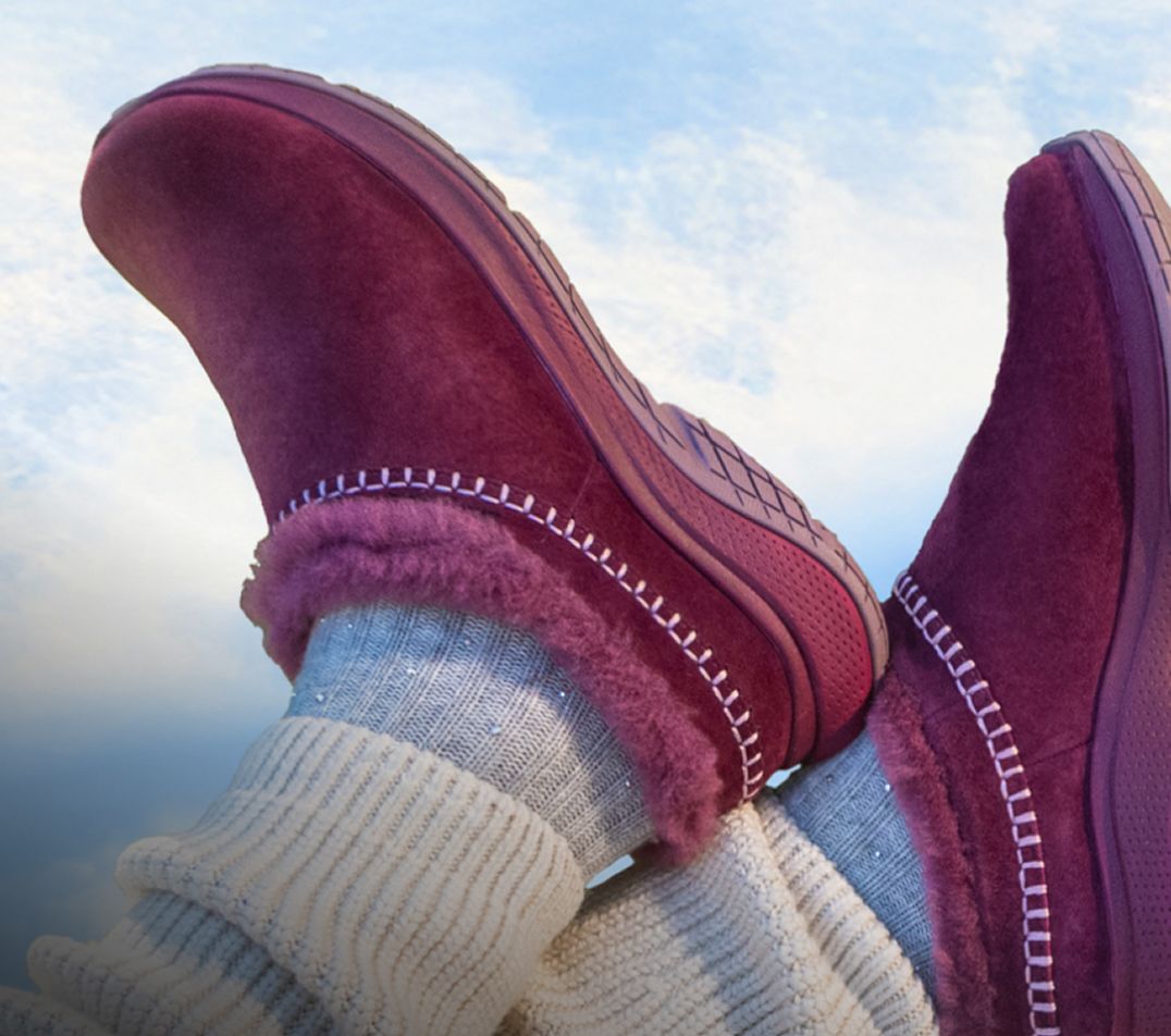 Person tying Merrell running shoes